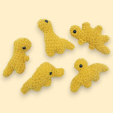 cute crochet chicken nuggets shaped into dinosaurs